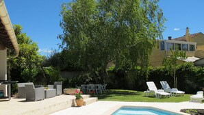 A backyard with a swimming pool, outdoor furniture, and a large tree. - A qui sian ben by Interhome (L'isle sur la Sorgue)