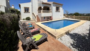 A villa with a swimming pool, outdoor seating, and a staircase leading to a balcony. - Lavanda by Interhome (Jávea)