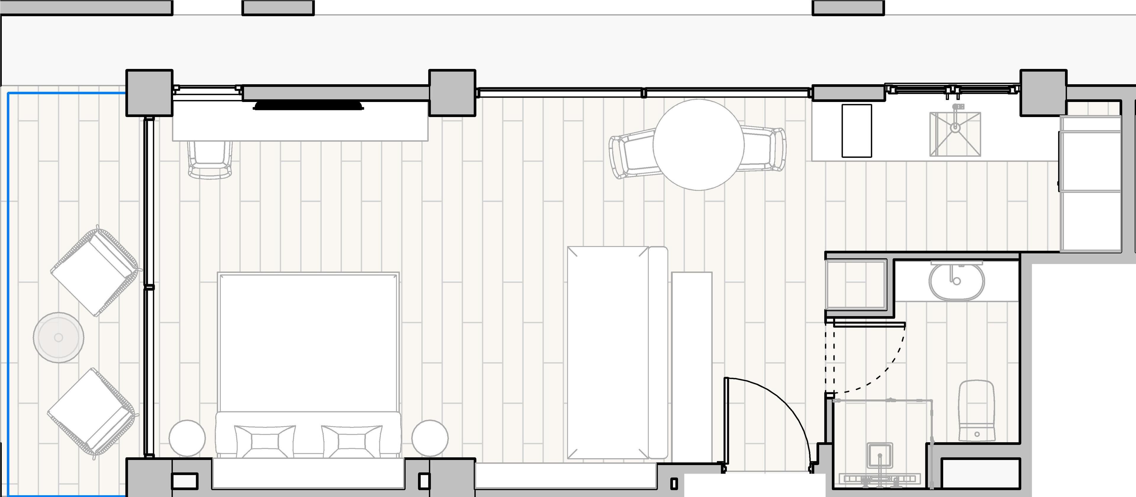 Ein Hotelgrundriss mit einem großen zentralen Wohnbereich, einem Essbereich, einer Küche und einem kleinen Badezimmer.