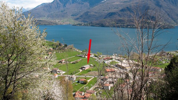 A mountainous landscape with a lake and a village. - Gelsomino by Interhome (Dongo)