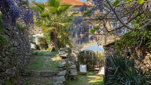 A stone pathway leading to a rustic building with a tiled roof. - Annina & Maria Luisa (DOL287) by Interhome (Dolcedo)