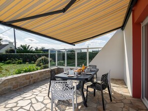 Enjoy a romantic meal under the stars in this serene outdoor dining area, surrounded by lush gardens.