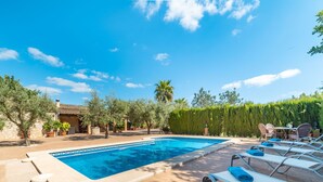 A swimming pool with lounge chairs and a patio area. - Son Catlar by Interhome (Inca)