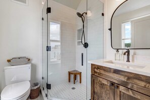 Shower, hair dryer, towels, soap