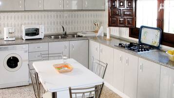 Fridge, oven, cookware/dishes/utensils