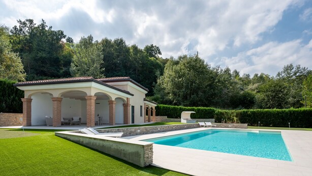 A modern house with a swimming pool, a covered patio, and a well-maintained lawn. - Appendino by Interhome (Asti)