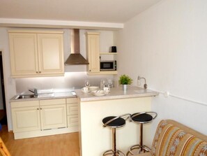 Fridge, microwave, toaster, cookware/dishes/utensils