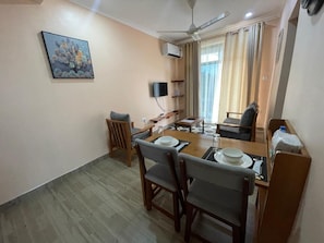 Comfort Apartment, 2 Bedrooms, Balcony, Mountain View | Living area | Flat-screen TV, printers - D&D Apartments (Moshi)