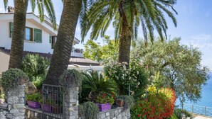A coastal property with stone walls, potted plants, and a view of the sea. - Villa Ginestra by Interhome (Ventimiglia)