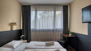 Desk, laptop workspace, free WiFi, bed sheets