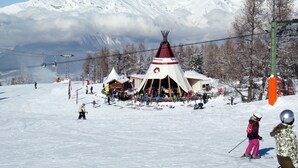 A ski resort with a lodge, ski lifts, and a mountain backdrop. - Dixence 212 by Interhome (Thyon-Les Collons)