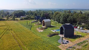 A rural property with multiple buildings, a swimming pool, and expansive green fields. - Romantic Stay with Views (Enneille)