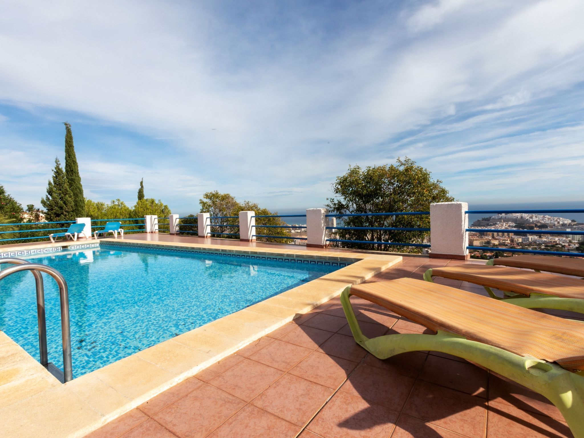 A rooftop pool with a clear view of the cityscape.