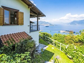 A house with a balcony overlooking a lake and mountains. - Tramonto (SEA116) by Interhome (Stresa)