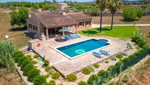 A house with a swimming pool, outdoor furniture, and a garden. - Jardines by Interhome (Felanitx)