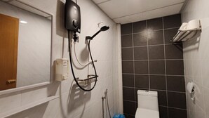 A bathroom with a shower, toilet, and sink. - SongTam Hotel  (Ipoh)