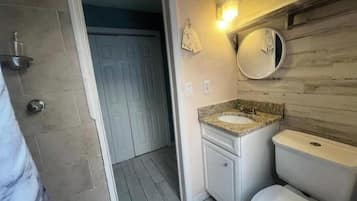 Shower, towels, soap, toilet paper