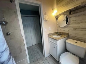 Shower, towels, soap, toilet paper