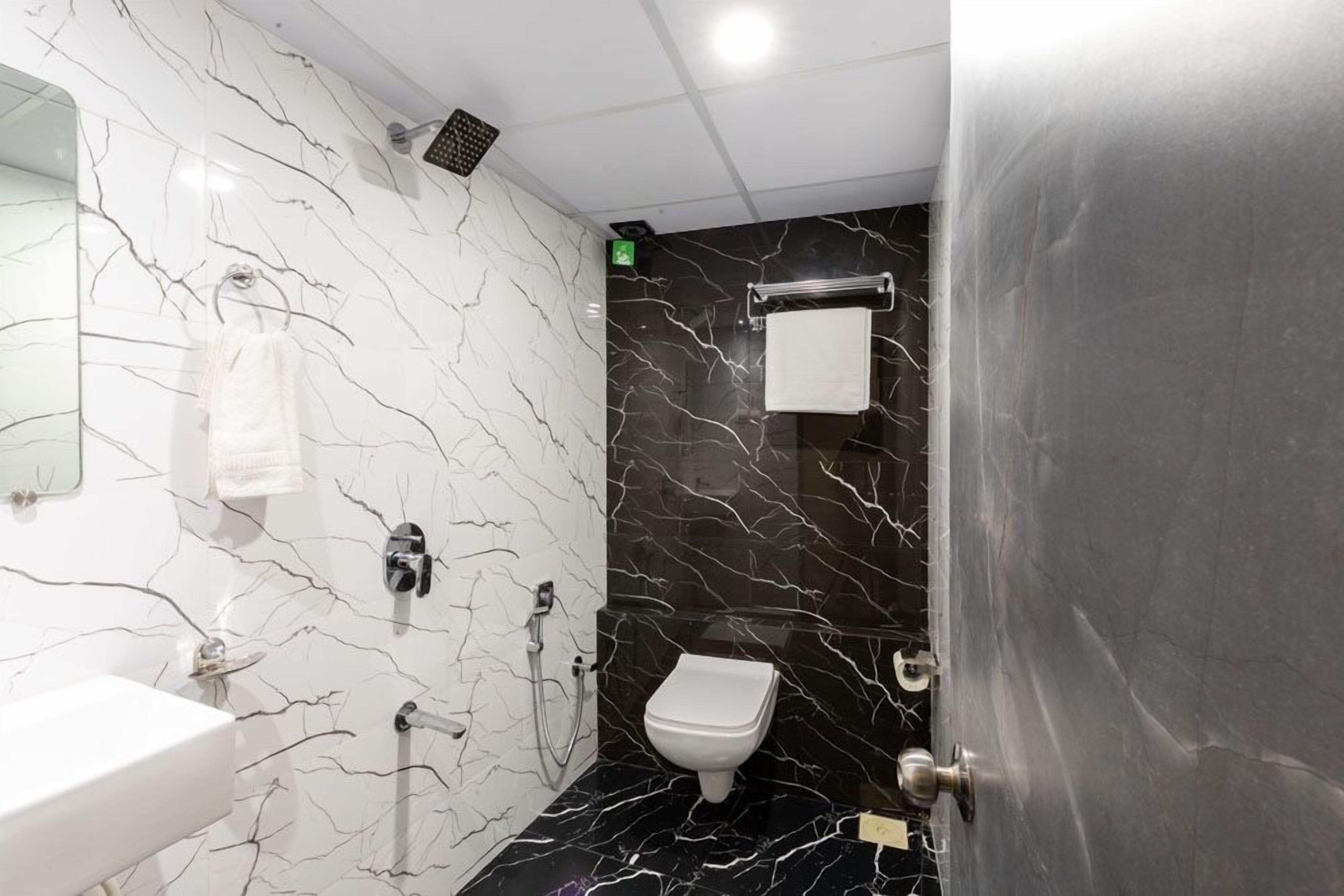 Shower, towels, soap, toilet paper