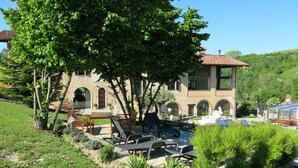 A villa with a garden, outdoor seating, and a fountain. - Cascinotta by Interhome (Bastia Mondovì)