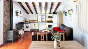 A compact living space with a kitchen, dining area, and seating area.