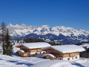 Experience the charm of a traditional Alpine-style hotel, nestled among snow-covered peaks and serene landscapes.