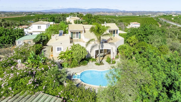 A large estate with a swimming pool surrounded by lush greenery and multiple buildings. - Monte Meco by Interhome (Silves)
