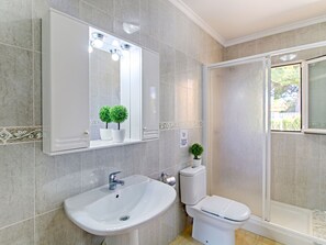 A modern bathroom with a large mirror, a sink, a toilet, and a shower. - Altamar by Interhome (Calpe/Calp)
