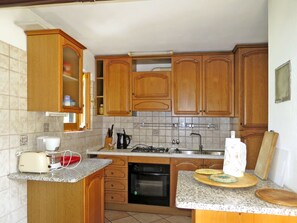 Fridge, oven, high chair, cookware/dishes/utensils