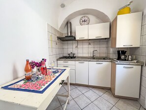 Fridge, microwave, toaster, cookware/dishes/utensils
