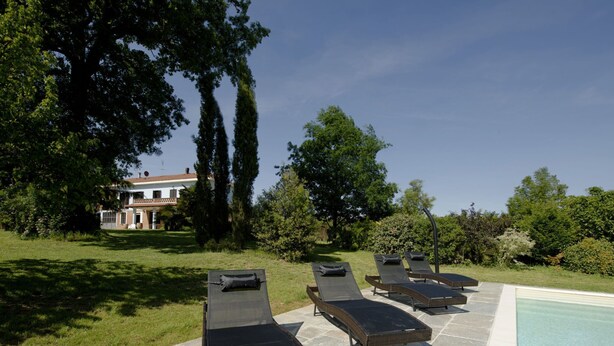 A poolside area with lounge chairs and a swimming pool. - San Giacomo by Interhome (San Damiano d'Asti)