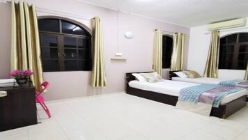 Desk, laptop workspace, bed sheets