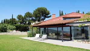 A modern house with a glass conservatory, a red roof, and a well-maintained lawn. - Baie de Bandol by Interhome (Sanary sur Mer)