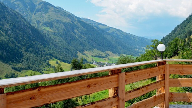 A wooden deck with a view of a mountainous landscape. - Vacation home Waltl by Interhome (Fusch)