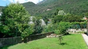 A lush green landscape with a view of mountains in the background. - casa dei fiori by Interhome (Mergozzo (Lago di Mergozzo))