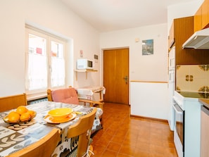 Fridge, microwave, toaster, cookware/dishes/utensils