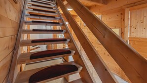 A wooden staircase with a handrail, leading to a door at the top. - Geislhof by Interhome (Bramberg am Wildkogel)