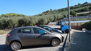 A parking area with a car and a truck. - Apartment Roseto by Interhome (Cervo)
