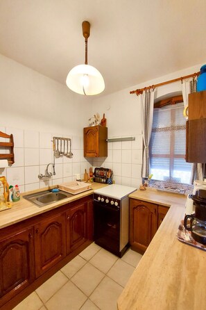 Fridge, microwave, oven, cookware/dishes/utensils