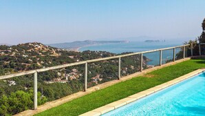 A swimming pool with a view of a coastal town and mountains in the background. - Xarmada Guillermo by Interhome (Begur)