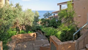 A staircase leading to a balcony with a view of the sea. - Su Tramatzu (PCR105) by Interhome (Porto Corallo)