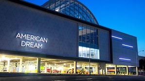 A modern building with a large glass facade and the words 'AMERICAN DREAM' on the side. - 3 BED/2 BATH<br>Free parking space<br>Near Rutgers University, Newark Penn Station, EWR airport, Prudential Center, MetLife Stadium, and more.<br>Fully equipped kitchen<br>Professionally styled (Newark)