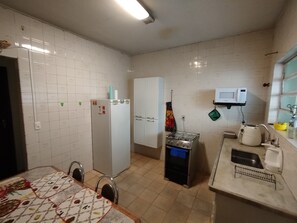 Fridge, microwave, stovetop, cookware/dishes/utensils