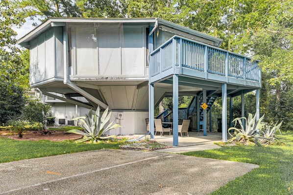 Stunning two-story house with a covered porch and beautifully maintained garden.