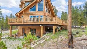A log cabin with a balcony, large windows, and a stone foundation. - NEW LISTING | 4BD Log Home in Twin Lakes, Amazing Views, Pets OK (Twin Lakes)