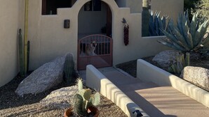A desert-style building with a tiled roof, a cactus garden, and a mountain in the background. - Casa Carefree 3 Bedroom Home by RedAwning (Carefree)