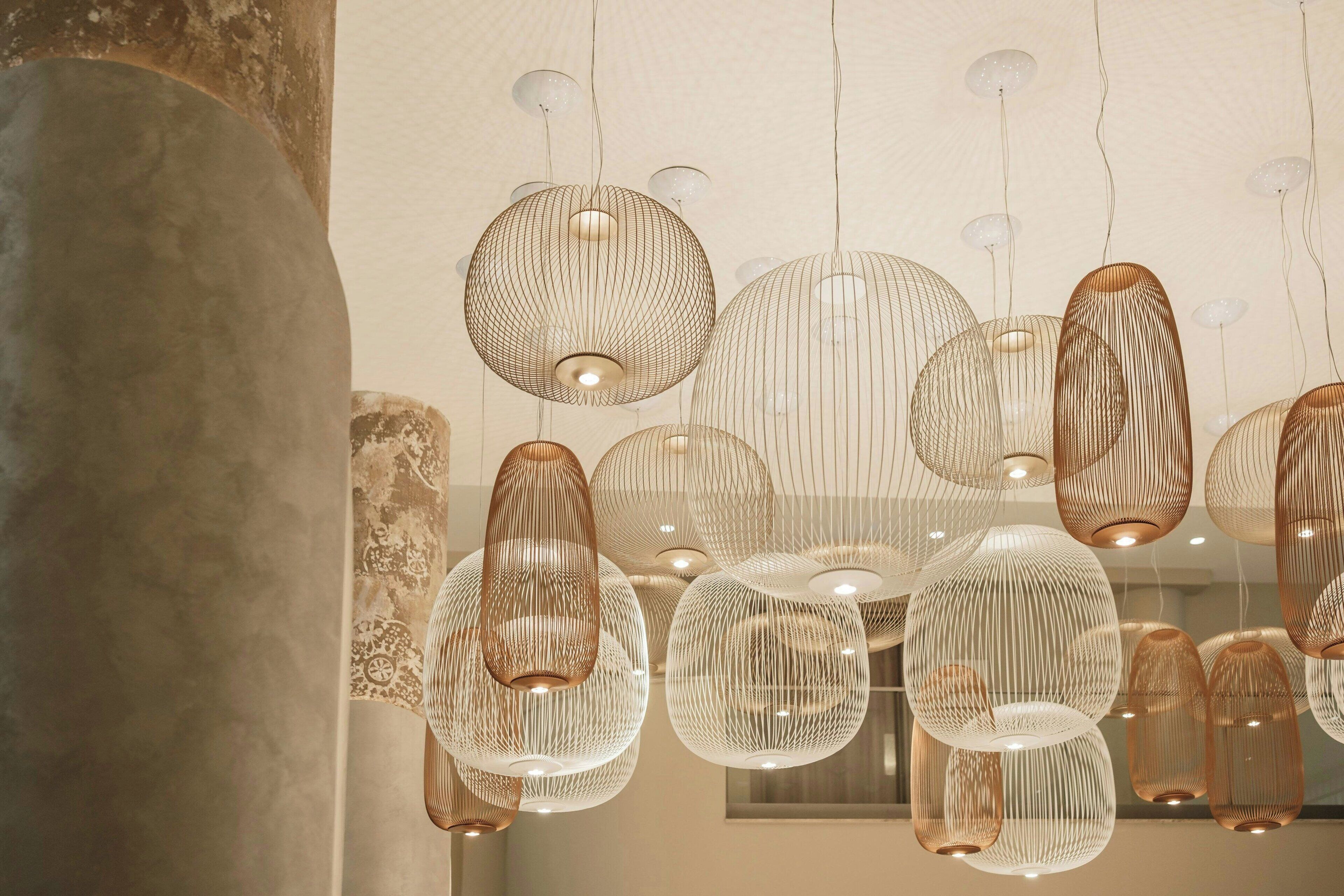 A modern interior with multiple hanging pendant lights.