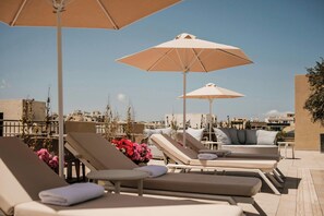 Indoor pool, outdoor pool, pool umbrellas, sun loungers