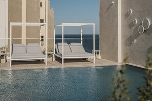 Indoor pool, outdoor pool, pool umbrellas, sun loungers