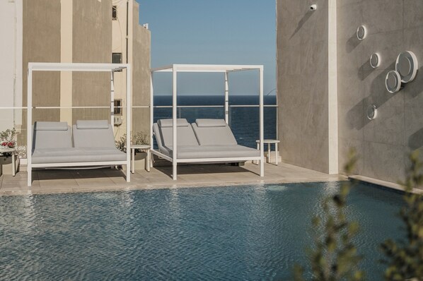 Indoor pool, outdoor pool, pool umbrellas, sun loungers